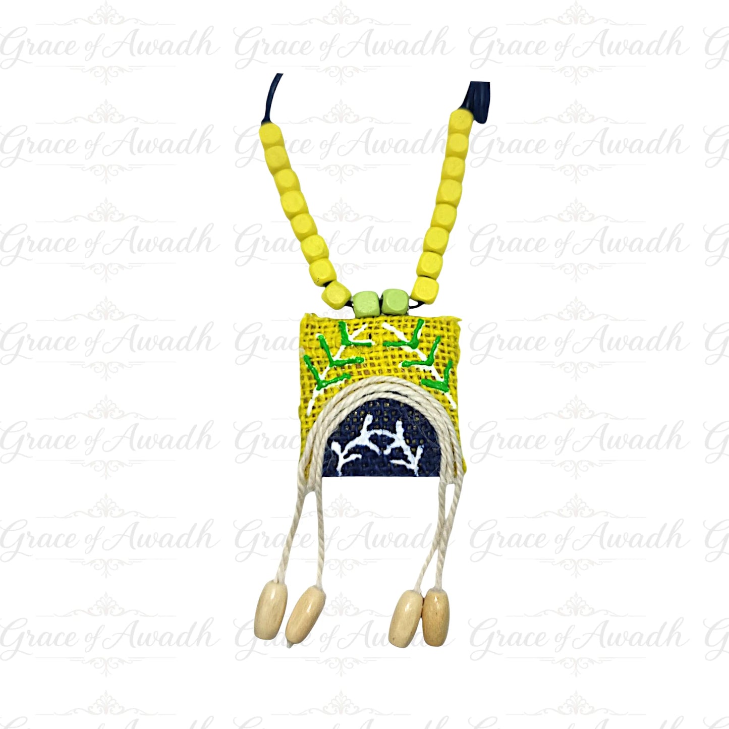 Necklace with yellow beads and a small pouch on a white background Noor-e-Baagh handcrafted yellow and blue fabric necklace with wooden beads and tassels – Grace of Awadh