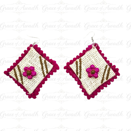 Pair of earrings with pink floral design on a white background, Phool-e-Nazakat white fabric earrings with pink floral appliqué and fuchsia border – Grace of Awadh